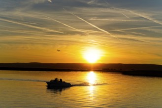 Lake Neusiedl, Burgenland, Austria, Europe, Motorboat leaves gentle waves in the water while