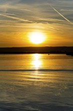 Lake Neusiedl, Burgenland, Austria, Europe, Sunset paints the sky in vivid colours while the water