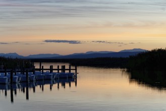 Lake Neusiedl, Burgenland, Austria, Europe, A lake at dusk with docked boats and soft colours,