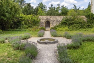Idyllic park at the Schoental Abbey located in Hohenlohe, a area in Southern Germany at summer time