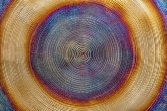 Full frame abstract closeup shot of a colorful metallic asian gong