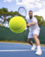 AI generated image showing a flying tennis ball closeup and player in court ambiance