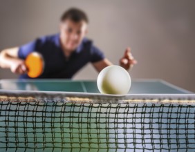 AI generated table tennis scenery including a ball, table with netting and player