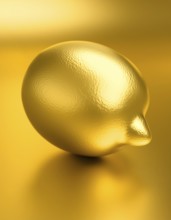 AI generated image showing a golden lemon fruit in golden ambiance