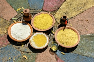 Food on a clay plate being offered to Exu in an Umbanda and Candomble ceremony