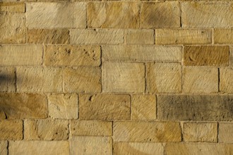 Yellow sandstone wall, sandstone wall, background, texture, Münsterland, North Rhine-Westphalia,