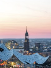 Aerial view of the Elbphilarmonie with St Michael's Church and Hamburg Bunker in the background at
