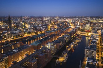 Aerial view of the historic warehouse district of Hamburg and Sandtor harbour at blue hour,