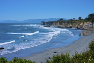Wide view of the coast with waves, cliffs and blue sky, Cape Foulwind, West Coast, South Island,
