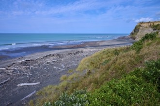 Wide coastal view with imposing cliffs, calm sea and cloudy sky, Mana Bay, Riverview Lookout,