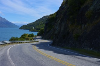 Winding road leads through remote landscape along a lake, Devil's Staircase Lookout Point,