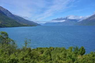 View of a lake framed by mountains and a blue sky, Drift Bay, Lake Wakatipu, Queenstown-Lakes