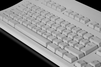 Studio photography of a grey key pad in black reflective back