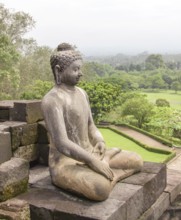 Buddha sculpture at a temple named Borobudur located in Java, a island of Indonesia