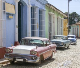 Classic cars seen in Cuba in sunny urban ambiance
