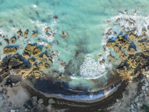 The Roche coves at he Mediterranean Sea. Aerial view. Drone shot. Cádiz province, Andalusia, Spain
