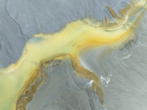 Abstract patterns in a waste pond in the mineral-rich area of the Rio Tinto mines. The colour is