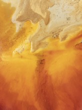 Abstract patterns in a pool in the mineral-rich area of the Rio Tinto mines. The colour is caused