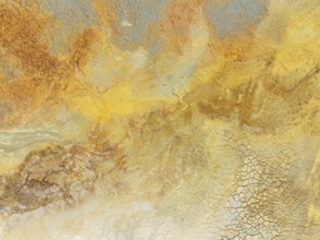 Abstract patterns in a waste pond in the mineral-rich area of the Rio Tinto mines. The colour is