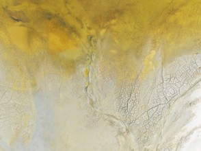 Abstract patterns in a waste pond in the mineral-rich area of the Rio Tinto mines. The colour is