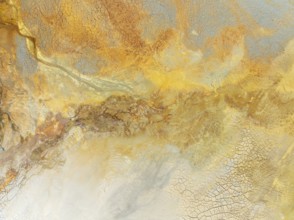 Abstract patterns in a waste pond in the mineral-rich area of the Rio Tinto mines. The colour is