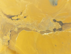 Abstract patterns in a waste pond in the mineral-rich area of the Rio Tinto mines. The colour is