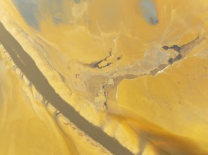 Abstract patterns in a waste pond in the mineral-rich area of the Rio Tinto mines. The colour is