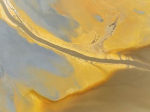 Abstract patterns in a waste pond in the mineral-rich area of the Rio Tinto mines. The colour is