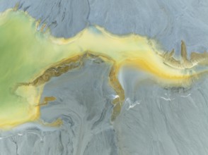 Abstract patterns in a waste pond in the mineral-rich area of the Rio Tinto mines. The colour is