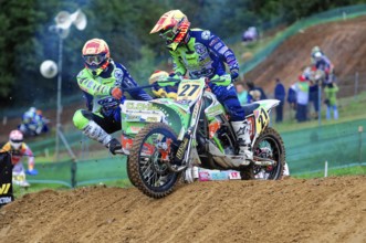 Motocross, Rudersberg, Baden-Württemberg, Germany, Europe, Two riders on a motorbike master a bend