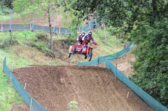 Motocross, Rudersberg, Baden-Württemberg, Germany, Europe, Two riders on a motorbike jump over a