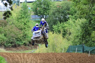Motocross, Rudersberg, Baden-Württemberg, Germany, Europe, Two riders jump through the air over a