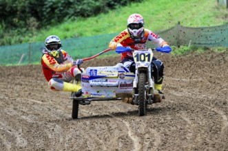 Motocross, Rudersberg, Baden-Württemberg, Germany, Europe, Rider with sidecar races through muddy
