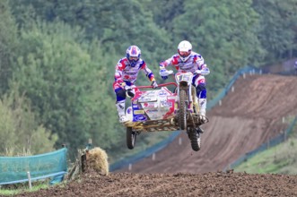 Motocross, Rudersberg, Baden-Württemberg, Germany, Europe, Two motocross riders with sidecars jump