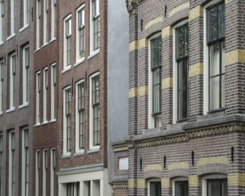 Detail of some house facades seen in Amsterdam (Netherlands)