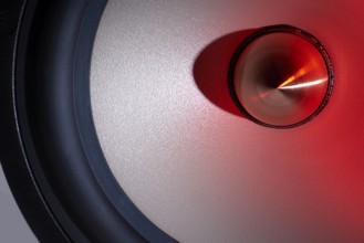 A red illuminated loudspeaker detail