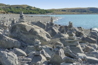 Coastal scenery with stone piles seen around Lake Pukaki at the South Island of New Zealand