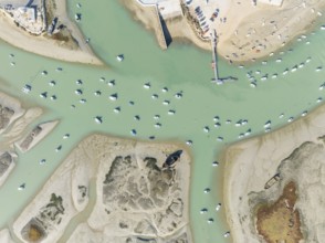 Fishing boats at low tide at the fishing village of Sancti Petri. In the marshland of the Bahía de