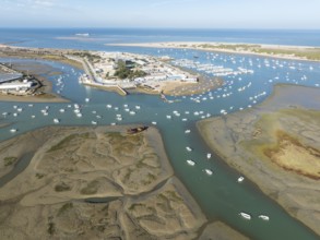 Network of channels and streams at low tide and the fishing village of Sancti Petri at the Atlantic