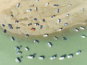 Fishing boats at low tide at the fishing village of Sancti Petri. In the marshland of the Bahía de