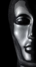 Translucent reflective human head made of glass in black back