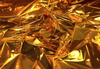 Full frame creased gold foil background