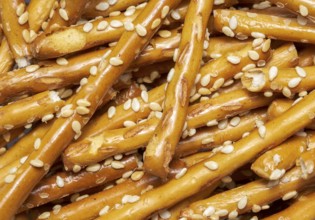 Full frame closeup of some baked sesame sticks