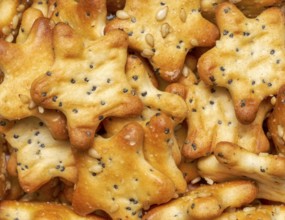 Full frame closeupof some baked crisp salty snack pieces