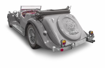 Rear view of a classic car isolated in white back with shadow