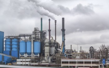 Industrial roadside scenery including a fabric and refinery