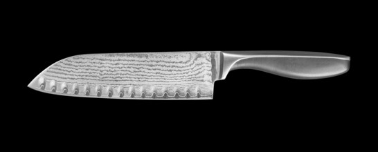 Pattern-welded kitchen knife isolated in black back