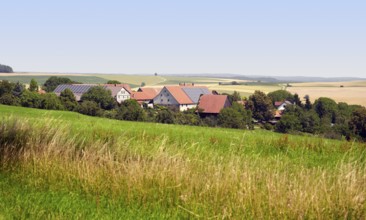 Small rural village in Southern Germany at summer time in agricultural ambiance