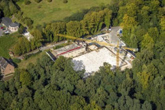 Aerial view, construction site and new building with construction crane Auf der Hardt, at LVR