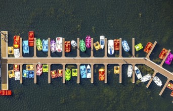 Aerial view, colourful pedal boats at a jetty on the Unterbacher See at the campsite north,